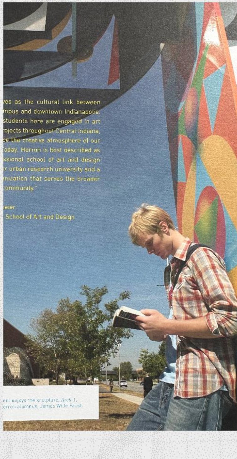 Jon Strand as a young art student reading beside a mural, featured by Herron School of Art and Design